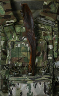 Jumbo venison skin dog chew displayed in a camouflage tactical vest.