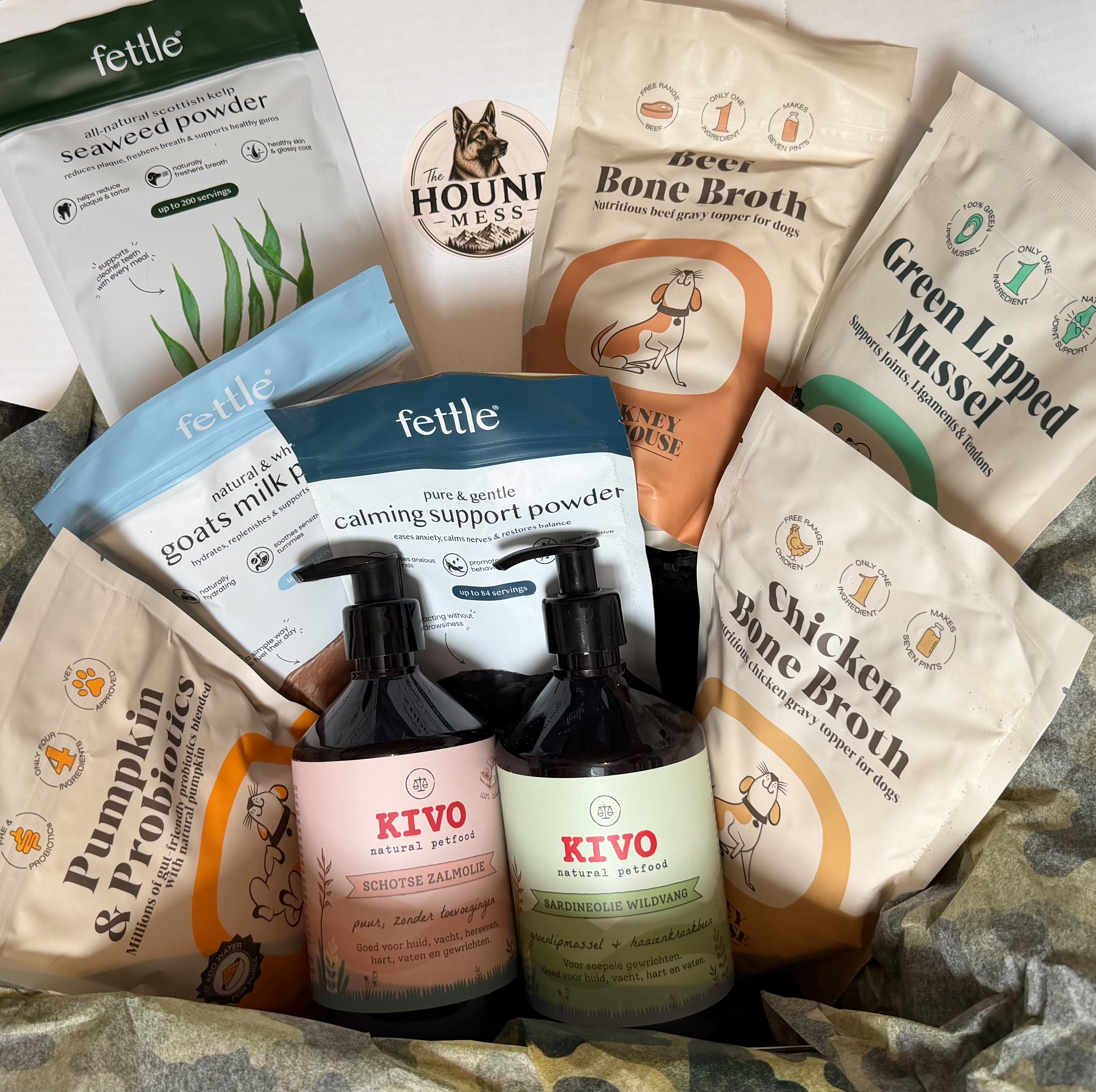 A curated set of supplements, featuring KIVO dog and cat care products like fish oil and Fettle premium supplements in colorful packaging.
